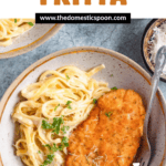 Pinterest image of an overhead bowl of Crispy Chicken Fritta with a fork and parsley.
