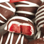 Pinterest image of a close-up shot of a frozen chocolate-covered strawberries missing a bite lying on top of a stack of decorated strawberries.