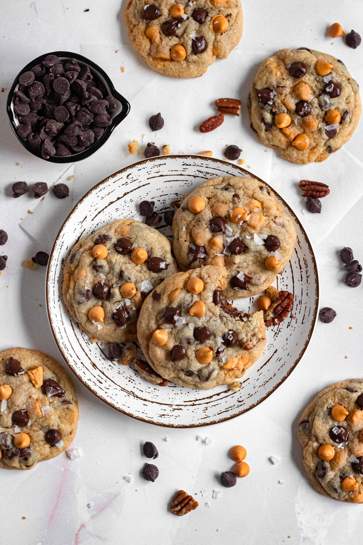 Baked butterscotch chocolate chip cookies on a plate.