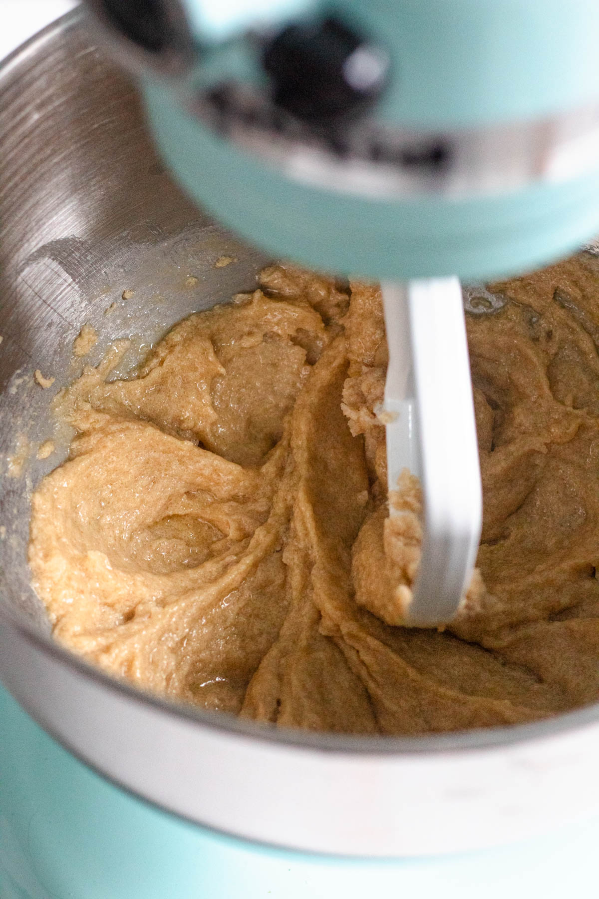 Creamed wet ingredients in the bowl of a stand mixer.