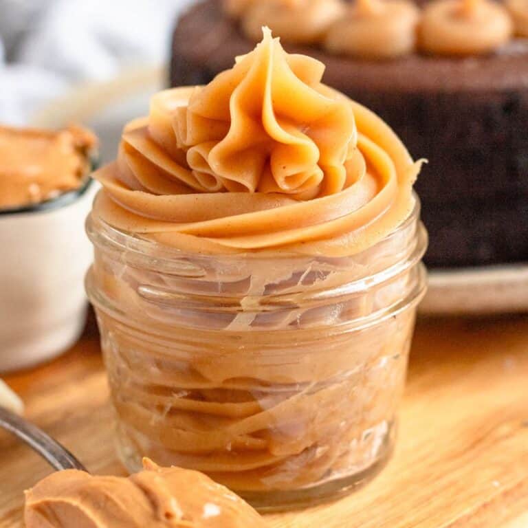 Peanut Butter ganache piped into a glass jar