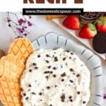 Pinterest image of booty dip with the dip in a bowl surrounded by pretzels, cookies, and fruit.