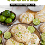 Pinterest image of Key Lime Cookies on a plate with key lime halves on the plate next to it, with more cookies and lime halves next to the plate.