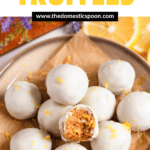 Pinterest image of a plate of Lemon Truffles with a bite taken out of one of the truffles.