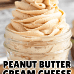 Pinterest image of a close-up shot of Peanut Butter Cream Cheese Frosting piped into a glass jar.
