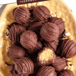 Pinterest image of an overhead shot of a plate of Peanut Butter Rice Krispies Balls.