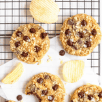 Pinterest image of an overhead shot of Potato Chocolate Chip Cookies on a cooling rack surrounded by potato chips.