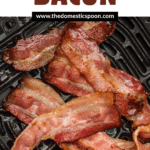 Pinterest image showing crispy bacon laying inside an air fryer bucket.
