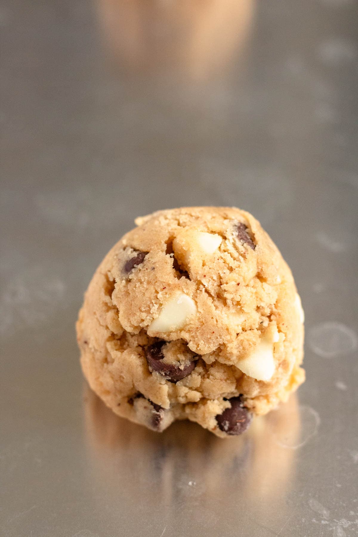 Scoop of mama kelce's cookies on a baking sheet.