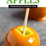 Pinterest image of dipped caramel apples on a cookie sheet.