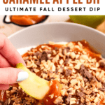 Pinterest image of an apple slice dipped into cream cheese caramel apple dip served in a bowl.