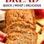Pinterest image of a hand picking up a slice of apple bread.