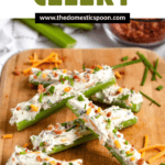Pinterest image of stuffed celery pieces leaning up against one another on a cutting board.