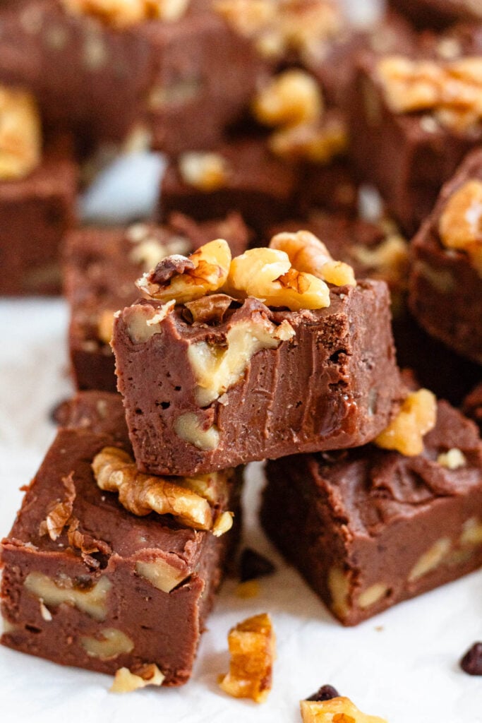 Close up picture of rich, and creamy carnation fudge with walnuts.