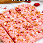 Pinterest image of the strawberry fudge cut into squares, topped with colorful sprinkles and edible pearls.