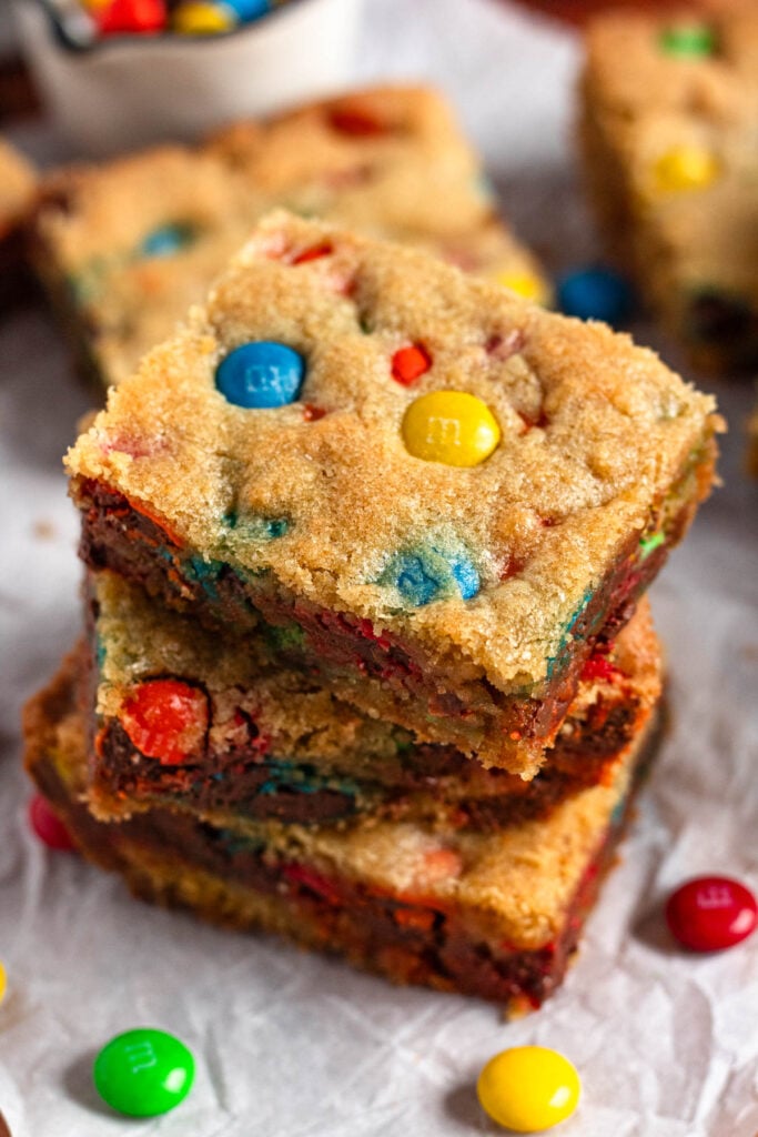 A stack of soft&chewy M&M cookie bars.