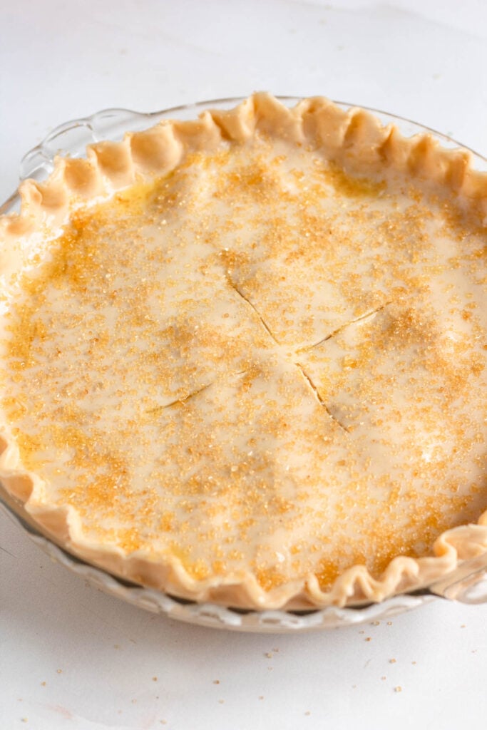 The pie edges were crimped in a decorative pattern to seal in the juicy filling, then dusted with coarse sugar.