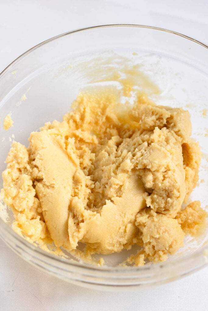 A box of yellow cake mix was mixed in a glass bowl.