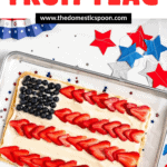 Pinterest image of a colorful American flag fruit pizza with blueberries and sliced strawberries on a creamy base.