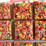 Pinterest image of nine vibrant Fruity Pebbles Rice Krispie Treats neatly cut into squares and displayed on a white surface with scattered mini marshmallows.