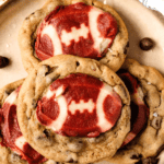 Pinterest image of a close-up shot of a plate of Football Cookies with chocolate chips and sea salt on the side.