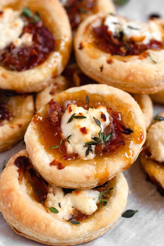 Delicious Goat Cheese Appetizer with apricot jam topped with fresh herbs.