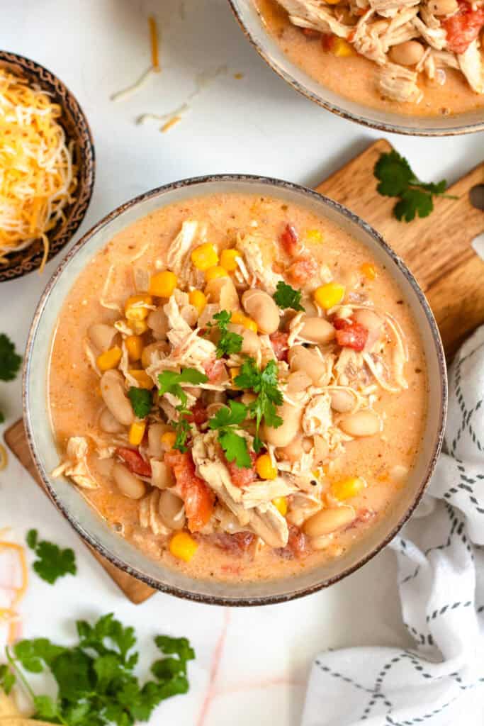 A bowl of creamy white bean chicken chili topped with fresh cilantro.