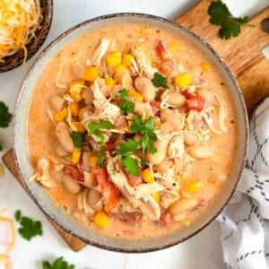 A bowl of creamy white bean chicken chili topped with fresh cilantro.