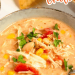 Pinterest image of a close-up shot of a bowl of creamy white bean chicken chili topped with fresh cilantro.