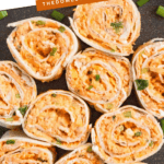 Pinterest image of a top-view of Buffalo Chicken Pinwheels on a plate.