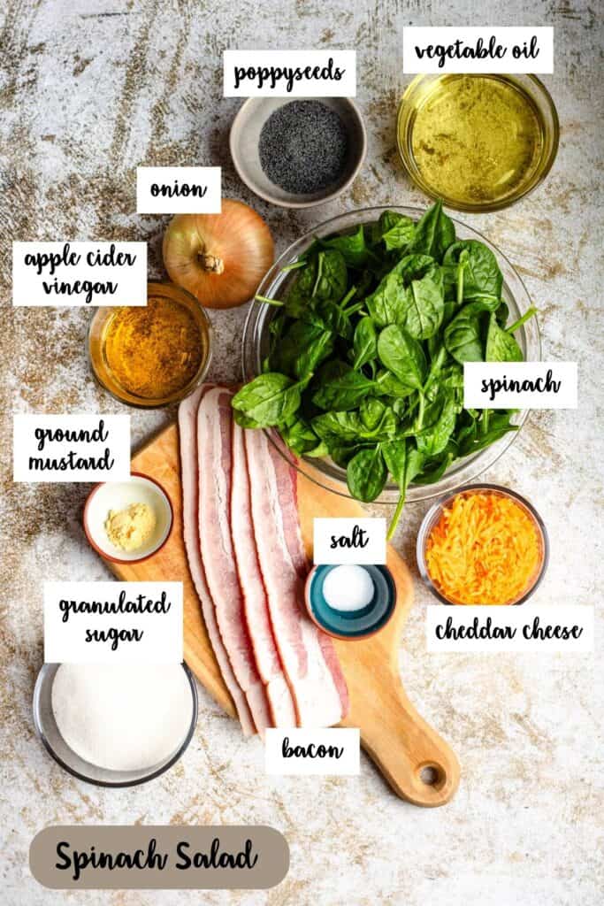 Ingredient shot of ingredients to make Spinach Salad with Bacon and Sweet Poppy Seed Dressing.