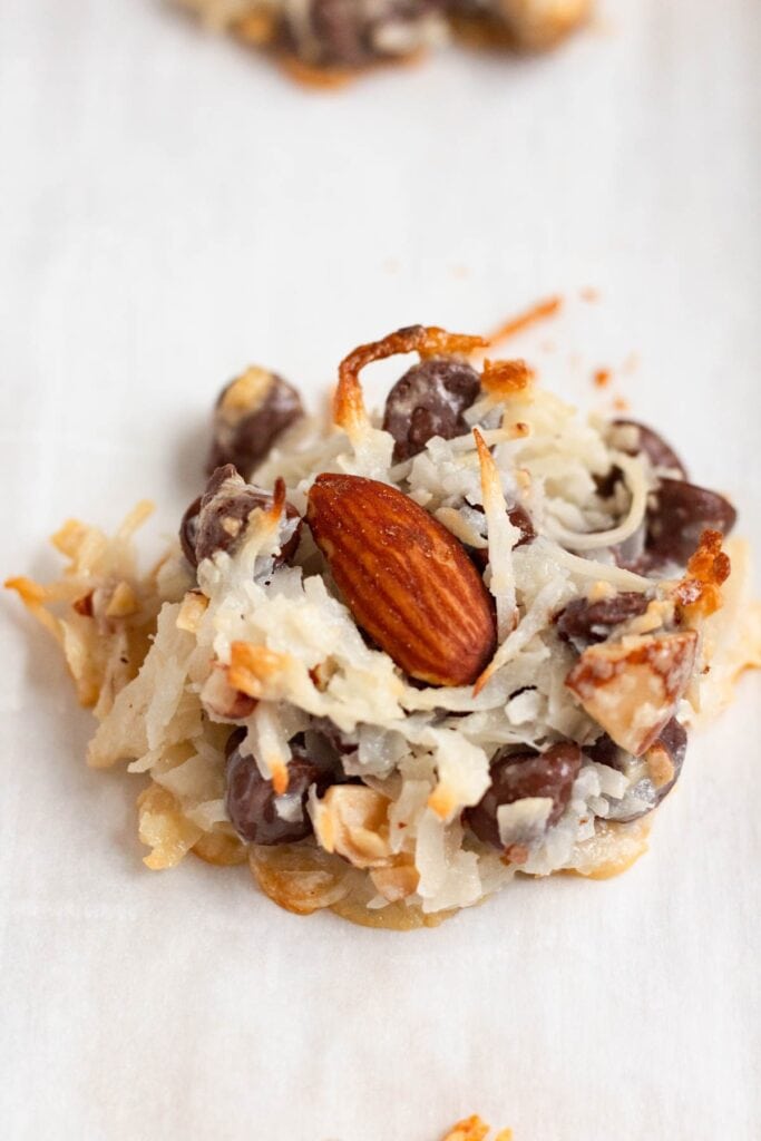 Fully baked almond joy cookie topped with an almond, ready to eat