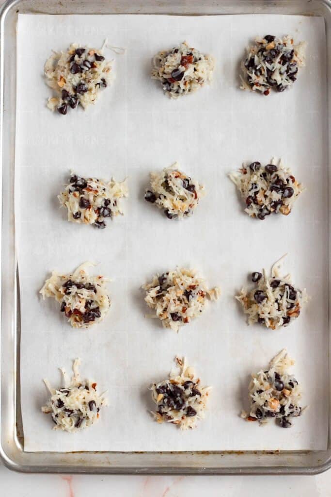 Small cookie balls placed on a baking sheet
