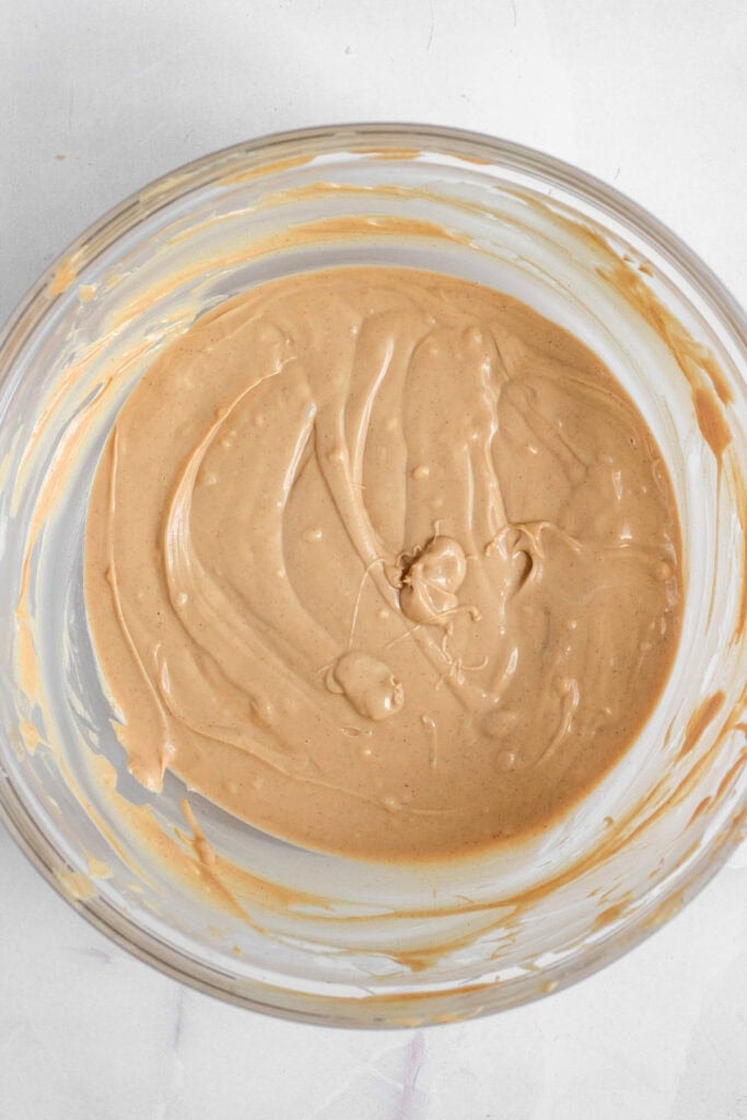 A bowl of melted chocolate and peanut butter.