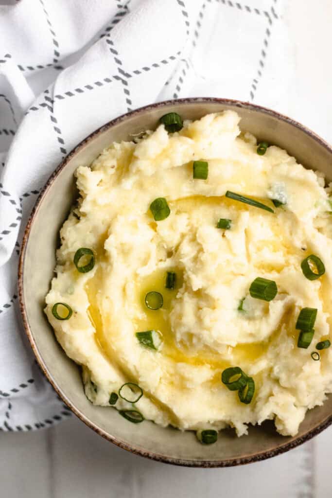 Delicious Horseradish Mashed Potatoes with butter and green onions.